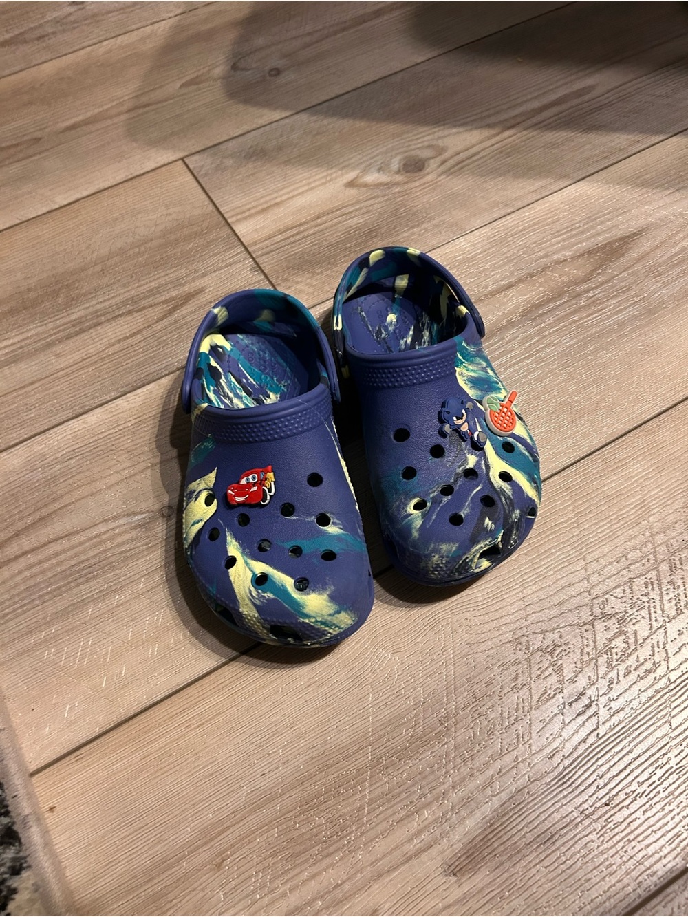 CROCS Kids Navy Blue Clog Sandals with Yellow Accent Swirl